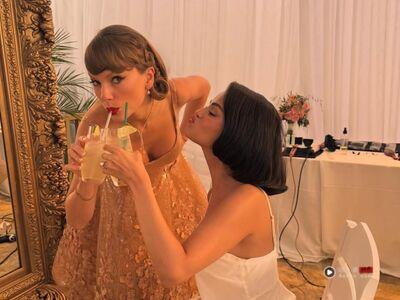 泰勒丝俏丽装扮不抢新娘风采 戴卡地亚LOVE手环献祝福